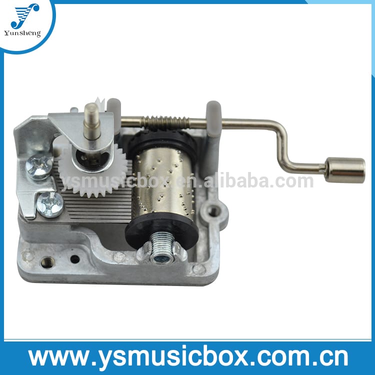 Silver Hand Operated Music Box Movement with Rotating Vertical Shaft Metal Handle Y2002 Featured Image