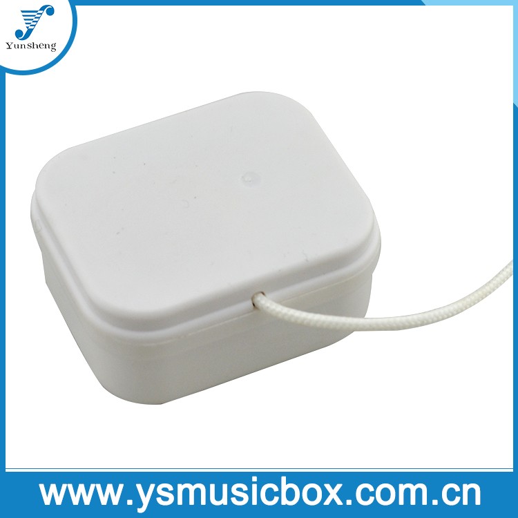 white case pull string music box